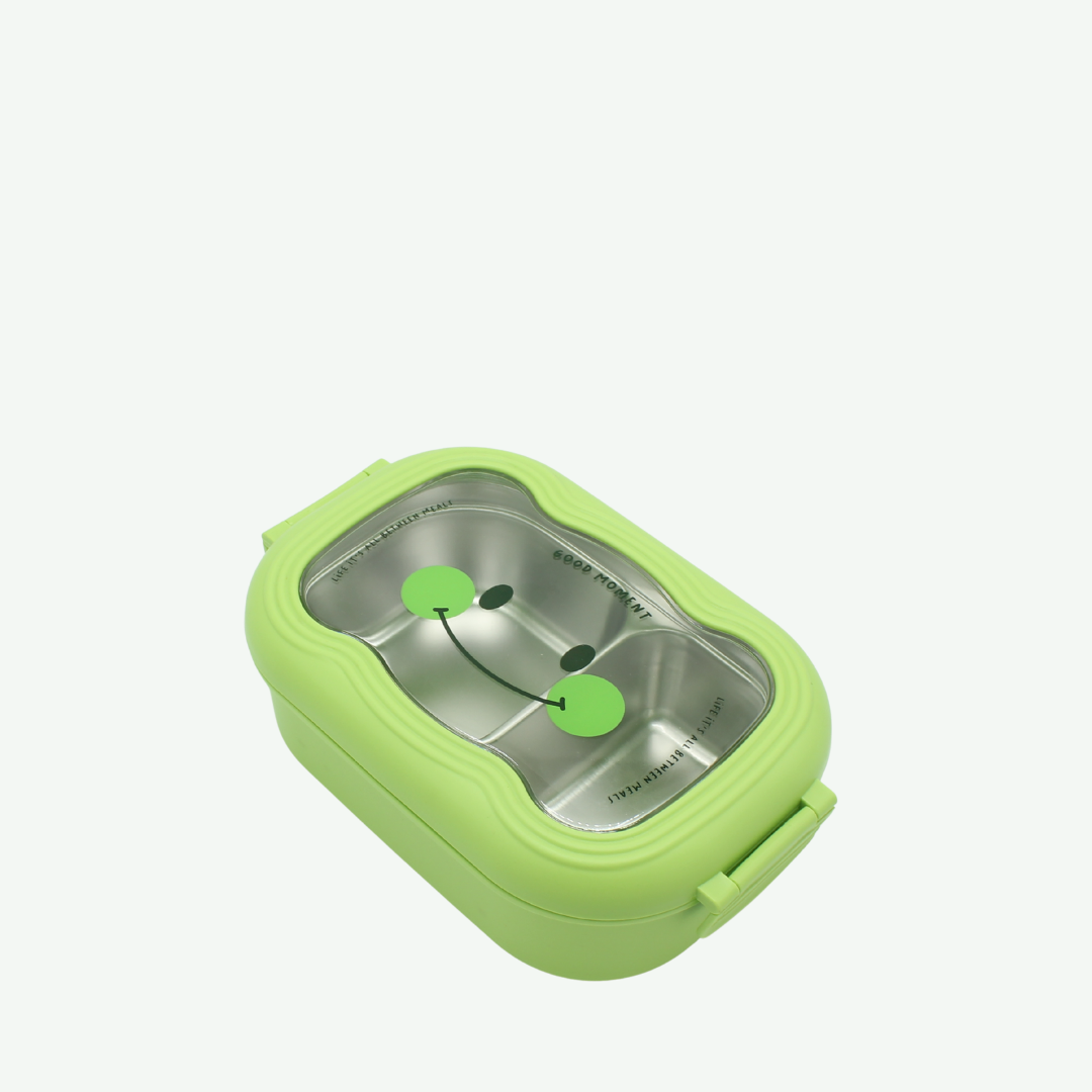 Green bento box with a metallic interior on a white background