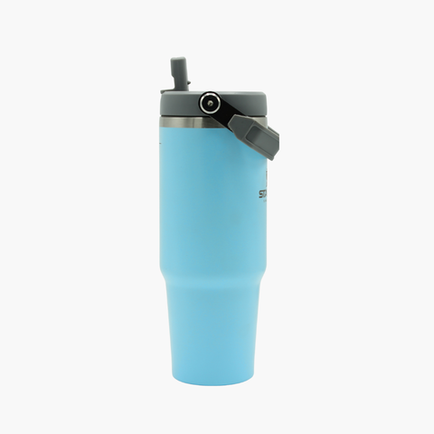Light blue tumbler with a black lid 