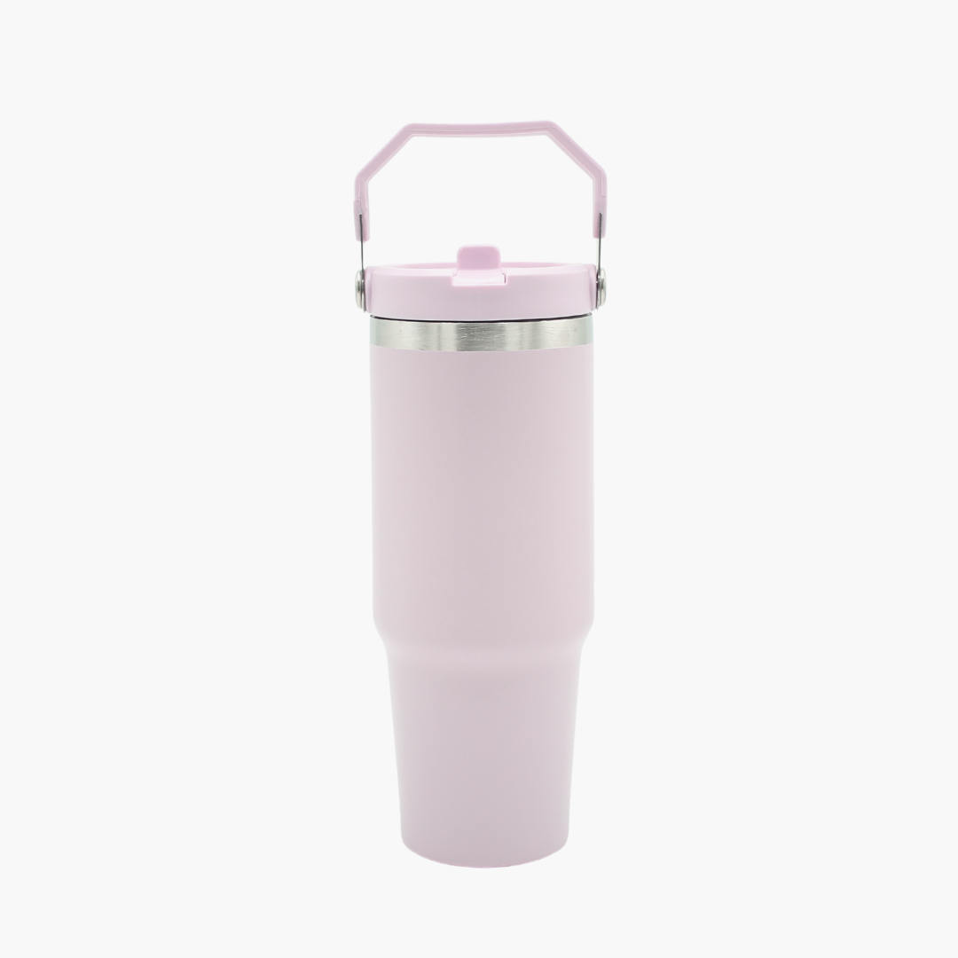 Pink insulated tumbler with a handle on a white background