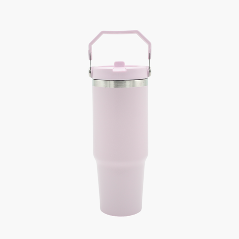 Pink insulated tumbler with a handle on a white background